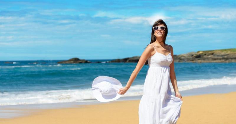22617758-joyful-woman-in-white-dress-enjoying-and-dancing-on-the-beach-during-summer-lifestyle-walk-relax-tra-stock-photo.jpg